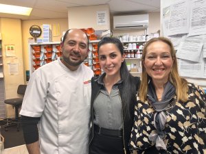 Selwan Farhan with fellow pharmacist owner and wife Shams Al-Muhena with Valentina Missen