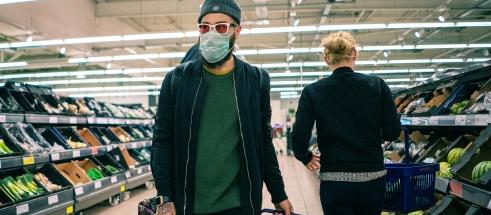 Supermarket shopper wearing mask, COVID-19 [photo: Nickolay Romensky/flickr.com]