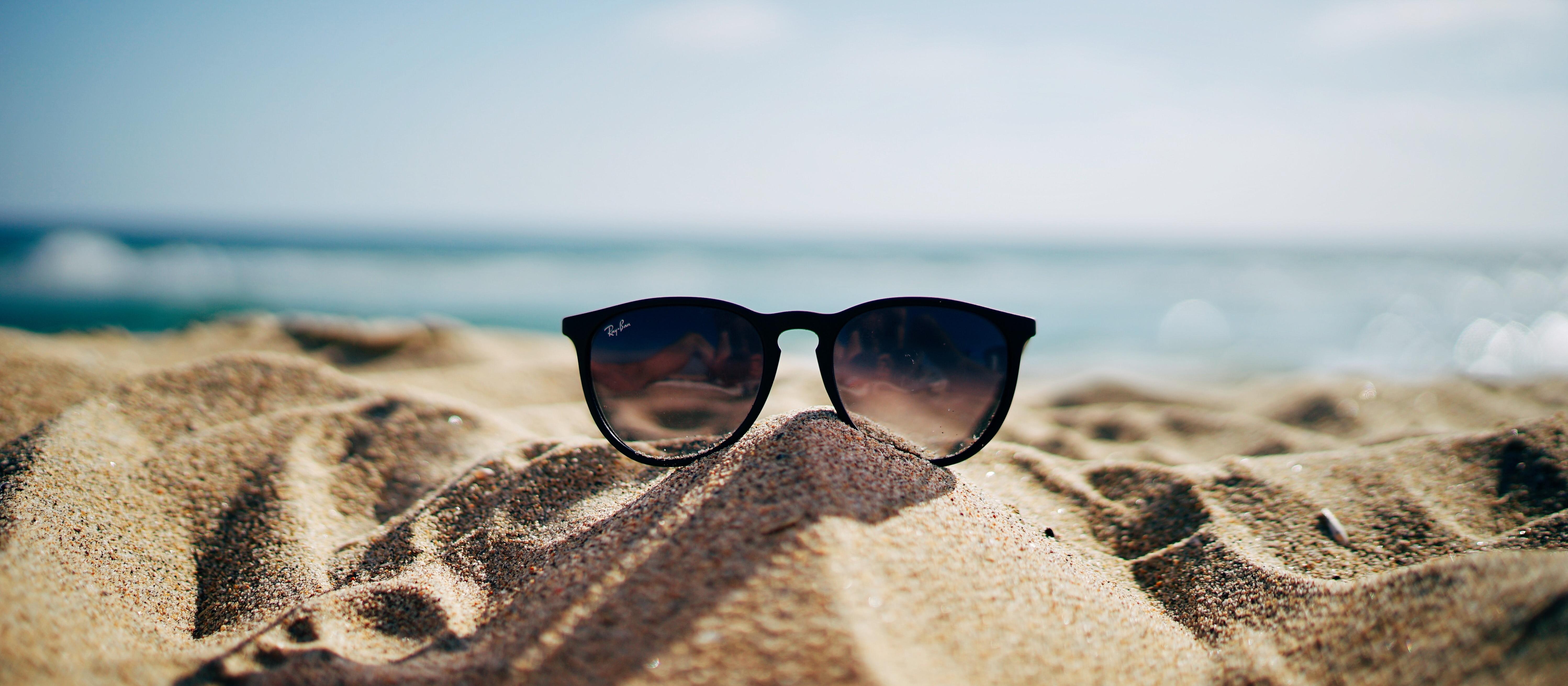 Summer, sand, beach, sunglasses [image: Ethan Robertson Unsplash]