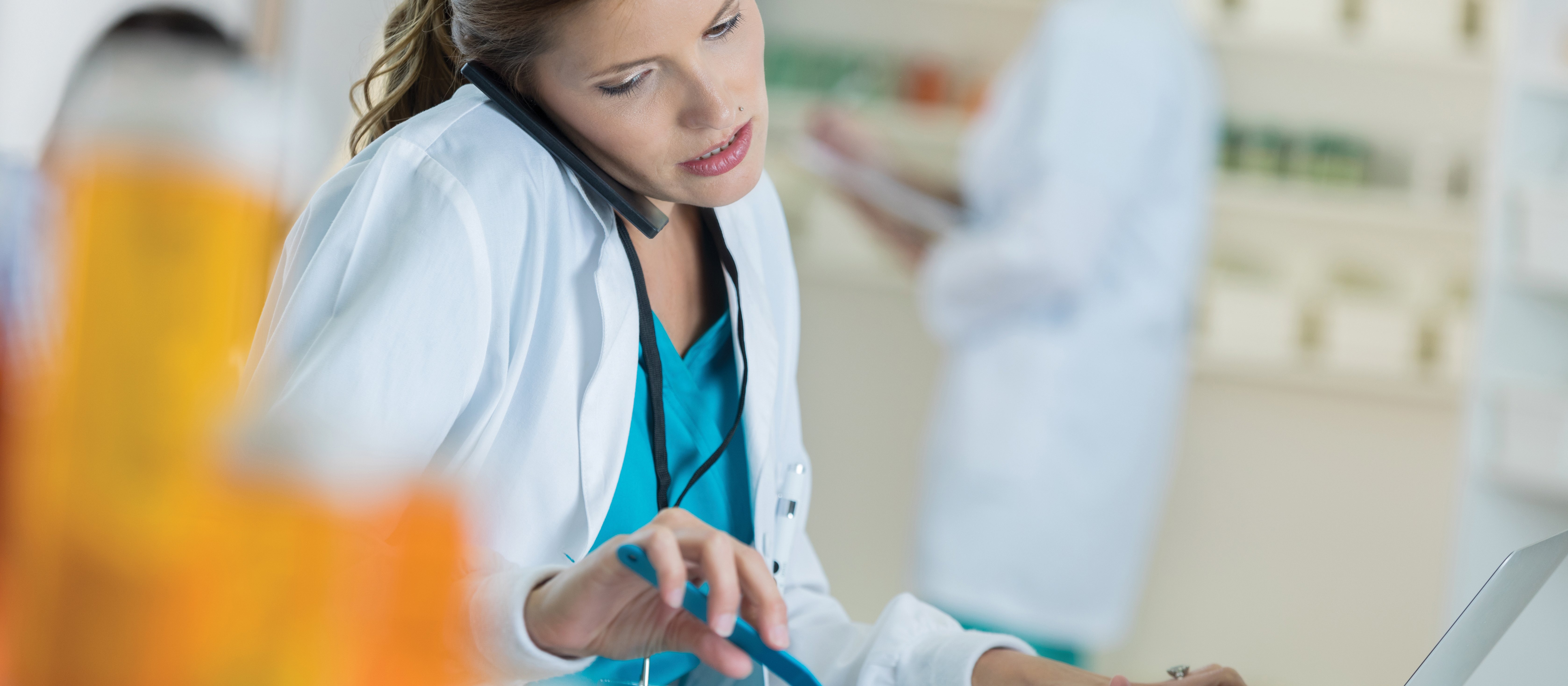 Multitasking female pharmacist