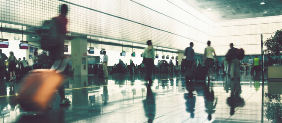 Travellers in busy airport