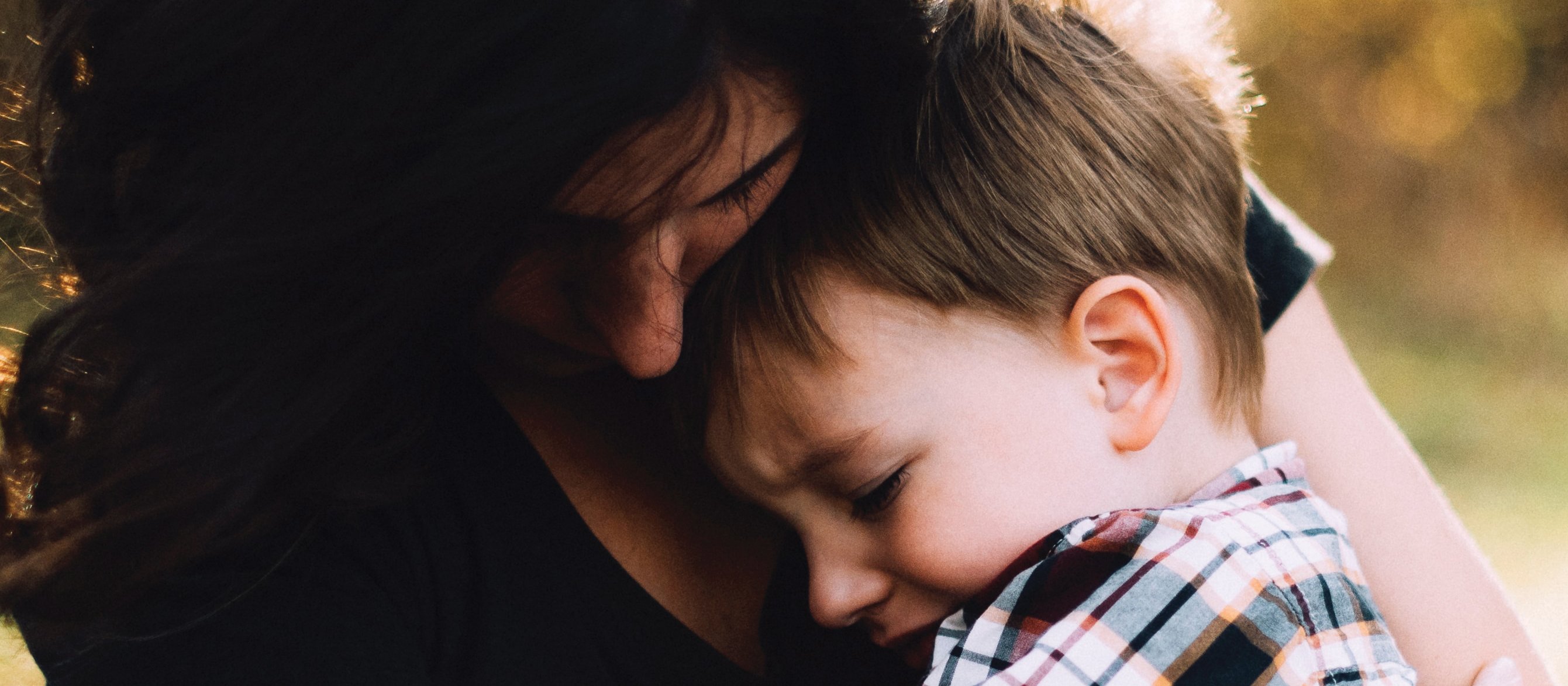Woman hugs child CR Jordan Whitt on Unsplash