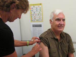 0416 Kevin Saunders gets his annual influenza immunisation from nurse Kristine Reid