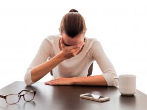 Woman with head down