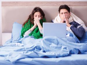 Couple sick in bed