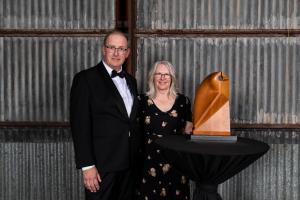 Adrian Tucker with his wife and the ACC Supreme award