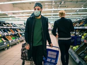 Supermarket shopper wearing mask, COVID-19 [photo: Nickolay Romensky/flickr.com]