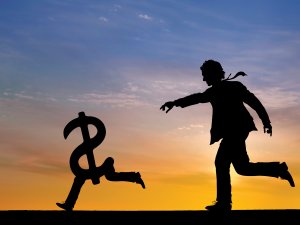 Man chasing money CR iStock/Grafissimo