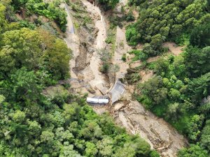 TRUCK TRAPPED BY FLOODING ON WASHED OUT SH2 BETWEEN NAPIER AND WAIROA, TAKEN BY NZDF NH90 CHOPPER [IMAGE: NZDF] 