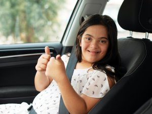 Down syndrome girl in car