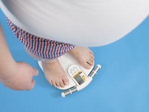 Overweight man on scales