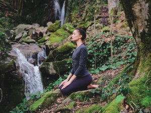 Woman Meditating forest CR Yolya on iStock