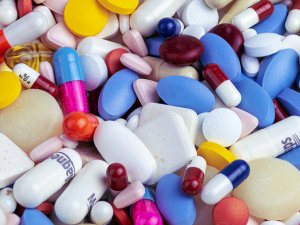 white blue and orange medication pill [Myriam Zilles on Unsplash]